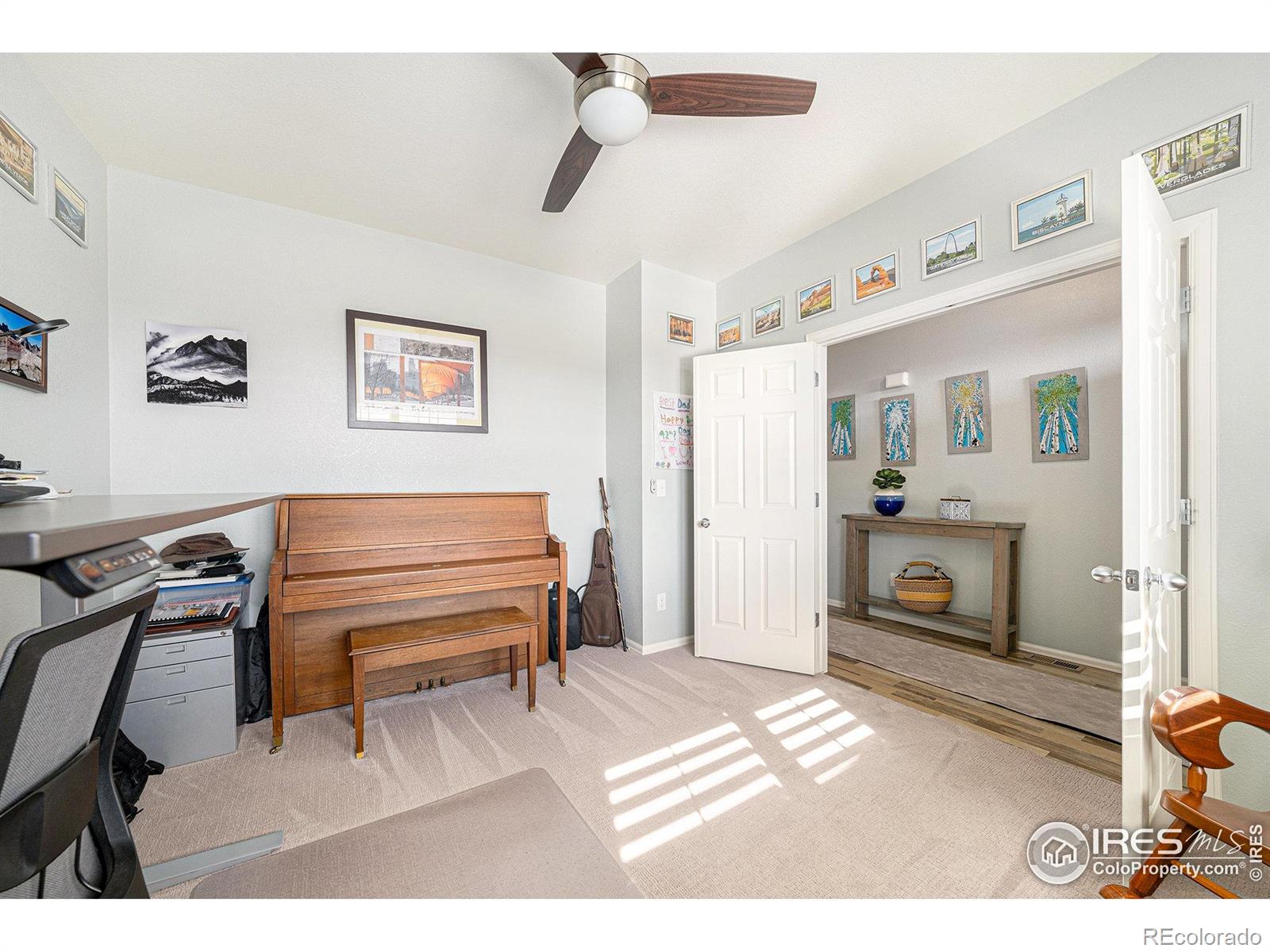 6778 Coach Light Court Timnath, CO 80547 - Photo 11 of 36 a bedroom with furniture and a fireplace