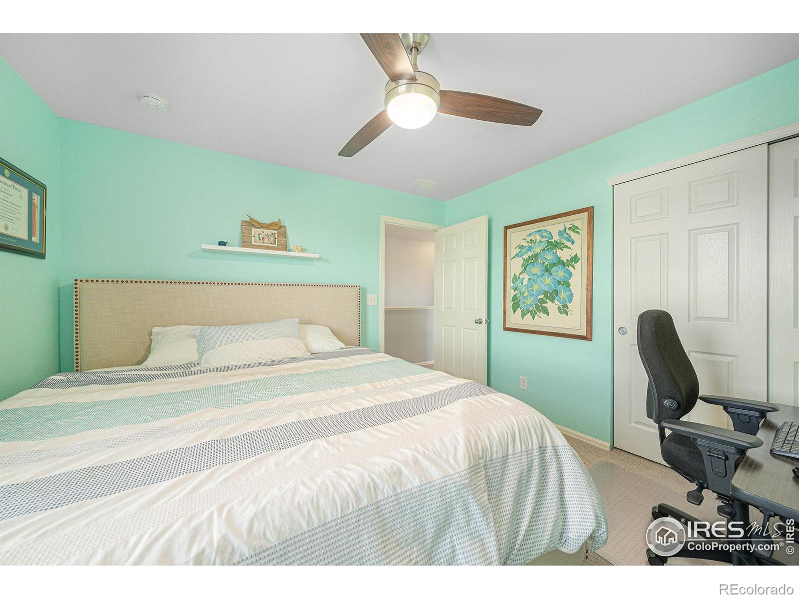 6778 Coach Light Court Timnath, CO 80547 - Photo 20 of 36 a bedroom with a bed a desk and chair