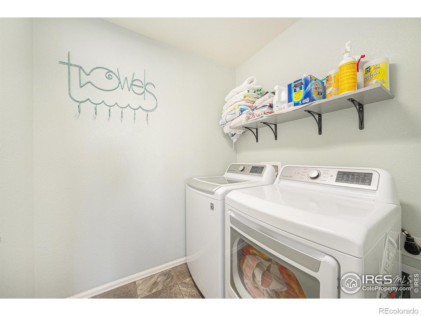6778 Coach Light Court Timnath, CO 80547 - Photo 23 of 36 a utility room with dryer and washer