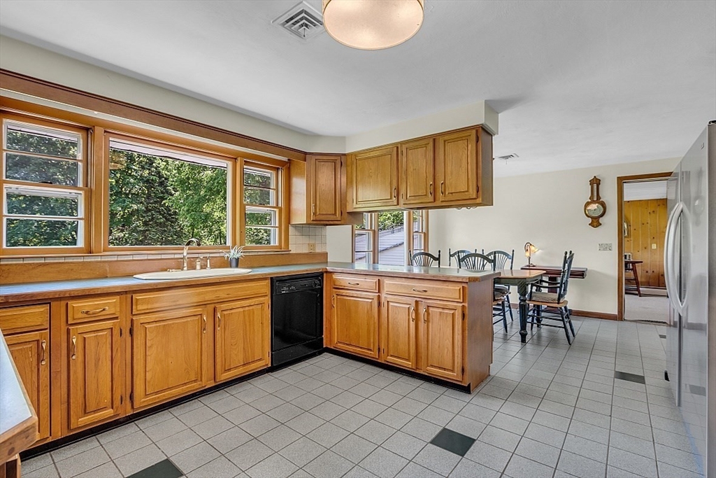 233 West Acton Road Stow, MA 01775 - Photo 13 of 41 a kitchen with granite countertop sink cabinets and stainless steel appliances