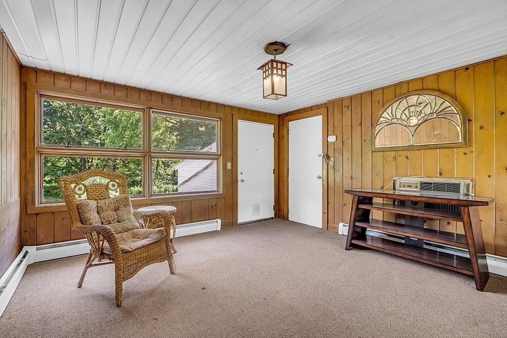 233 West Acton Road Stow, MA 01775 - Photo 17 of 41 a living room with furniture and a large window