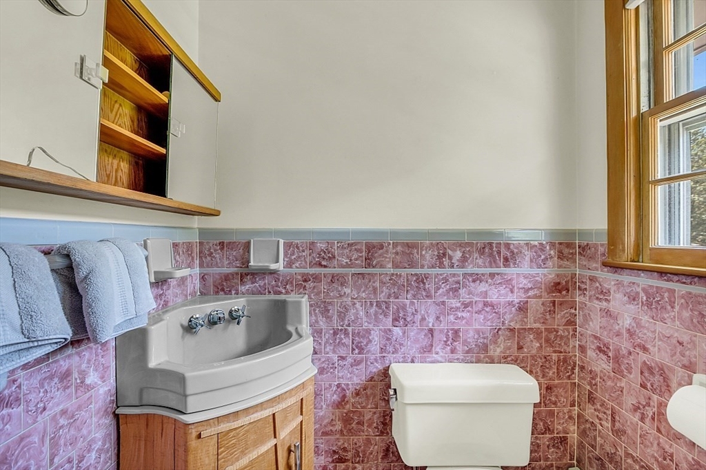 233 West Acton Road Stow, MA 01775 - Photo 27 of 41 a bathroom with a toilet sink and mirror