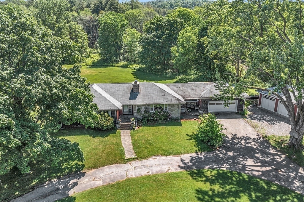 233 West Acton Road Stow, MA 01775 - Photo 34 of 41 a view of a house with a yard
