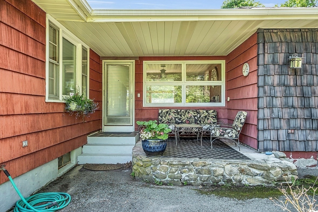 233 West Acton Road Stow, MA 01775 - Photo 5 of 41 a porch with seating space