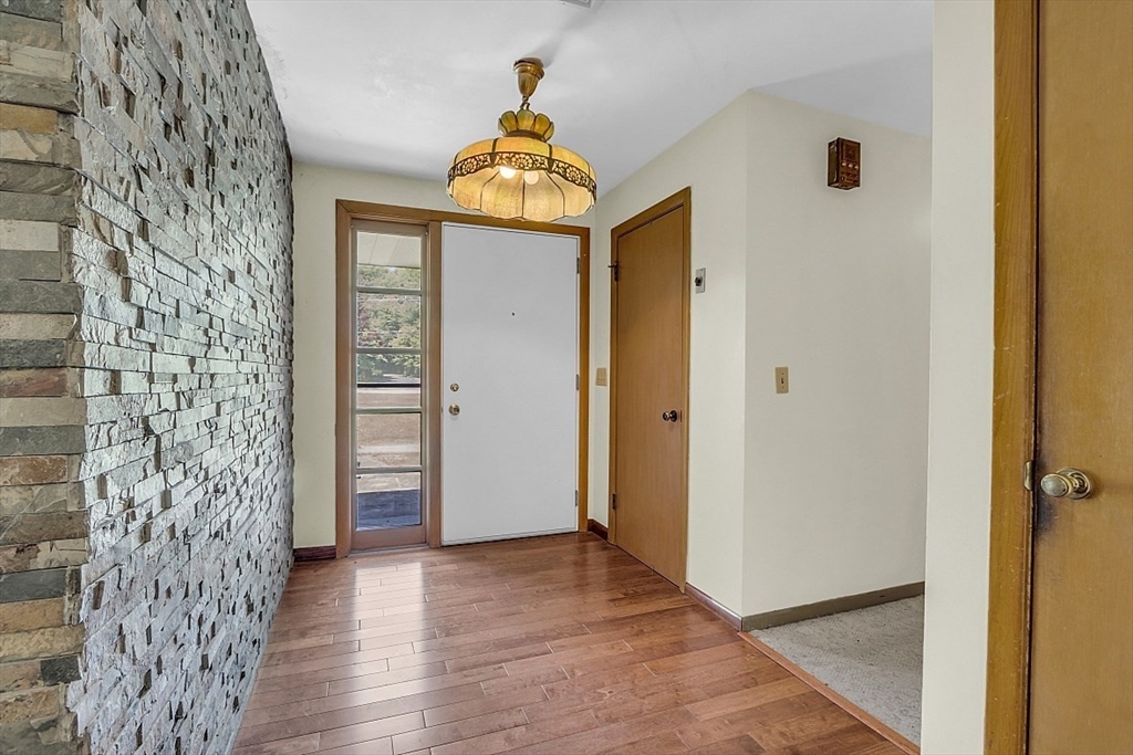 233 West Acton Road Stow, MA 01775 - Photo 7 of 41 wooden floor in an empty room with a door