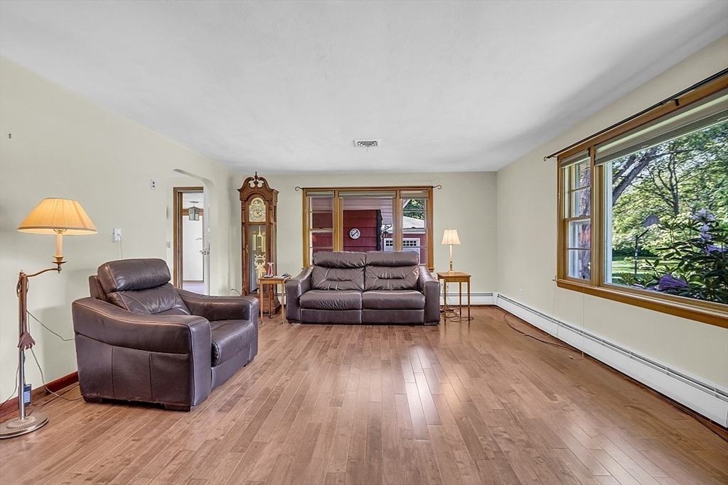 233 West Acton Road Stow, MA 01775 - Photo 9 of 41 a living room with furniture and a large window