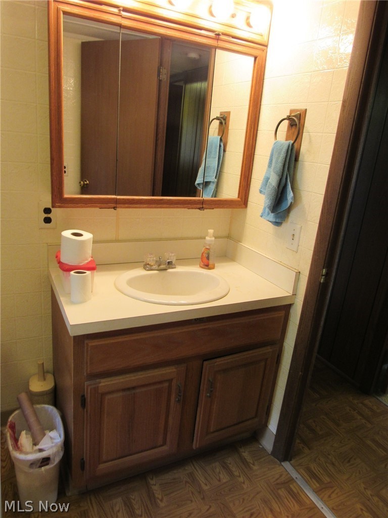 1575 Dodgeville Road Rome, OH 44085 - Photo 9 of 26 Bathroom vanity, mirror and medicine cabinet.