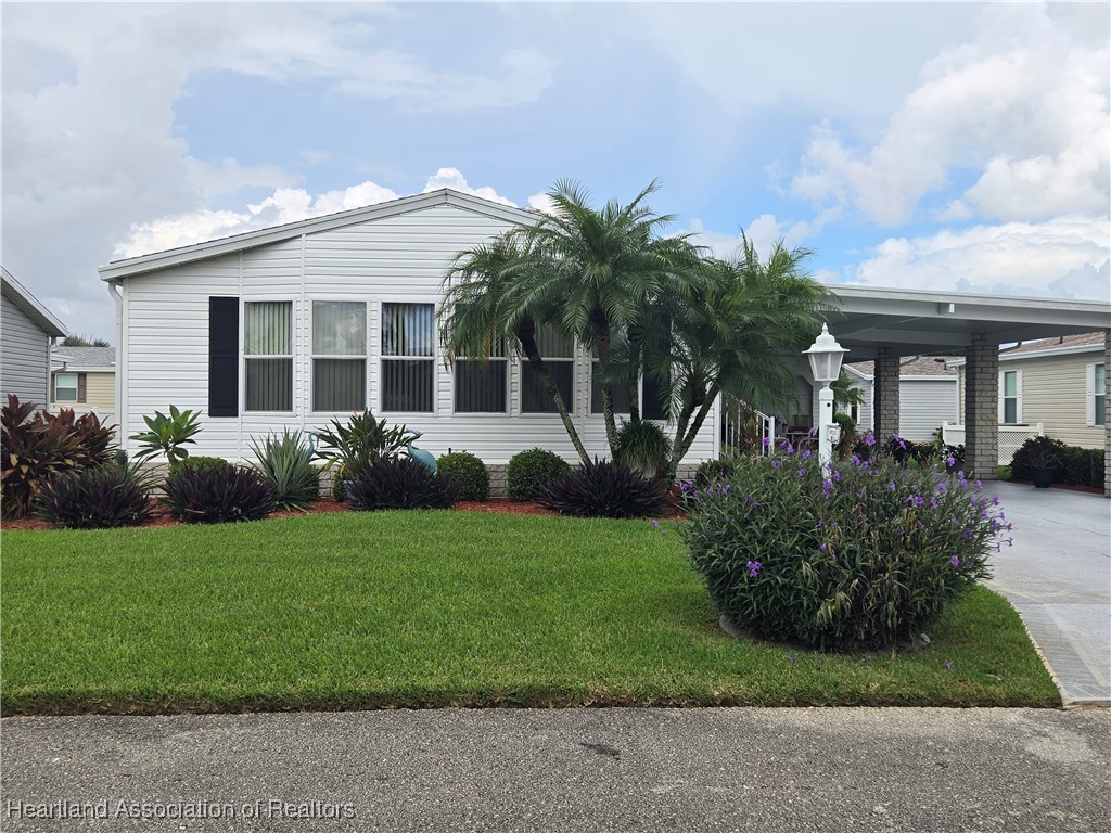 3312 Beartooth Pass Sebring, FL 33872 - Photo 1 of 39 a front view of house with yard and green space