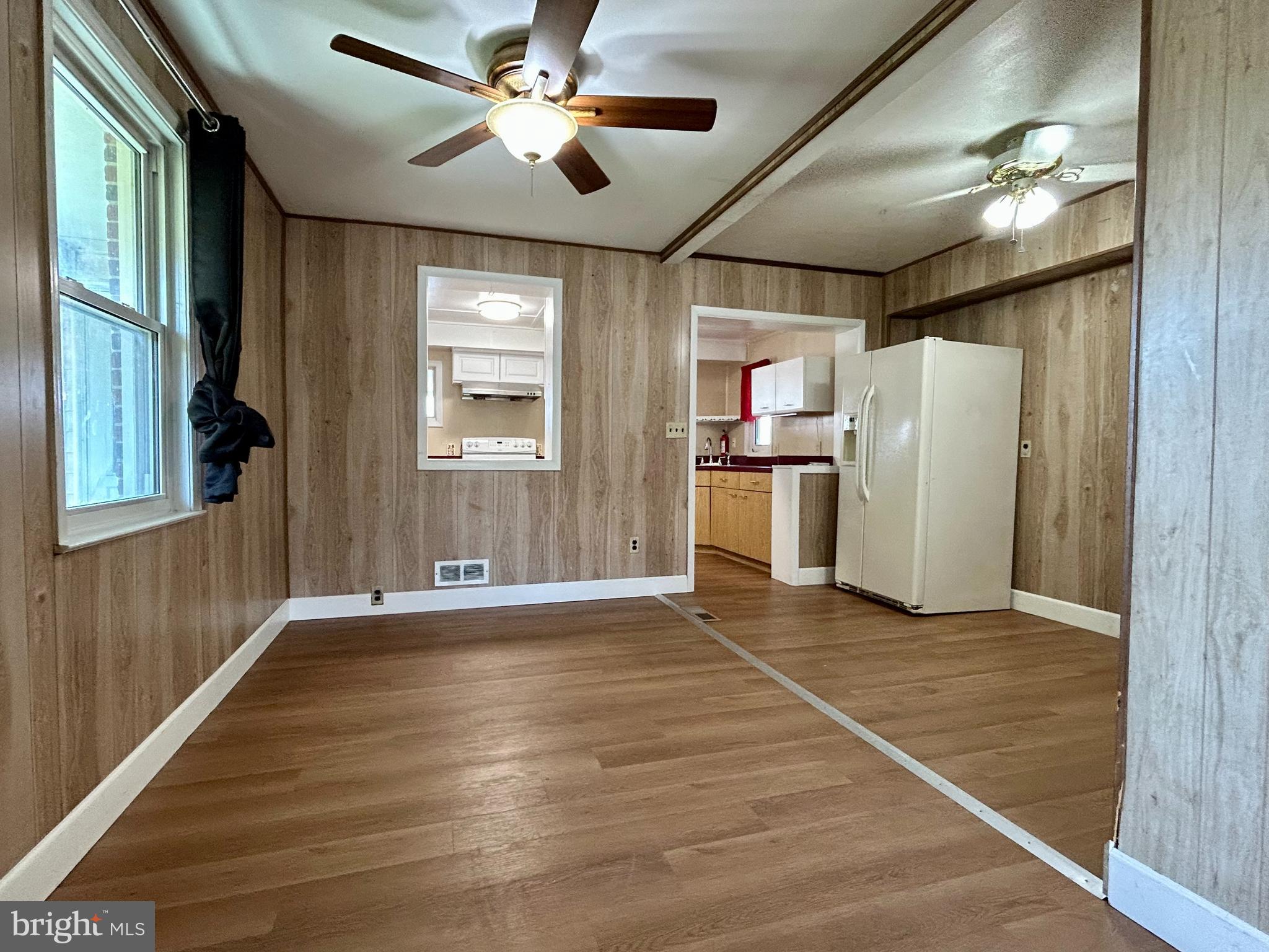 7242 Conley Street Baltimore, MD 21224 - Photo 5 of 18 a view of an empty room with a window