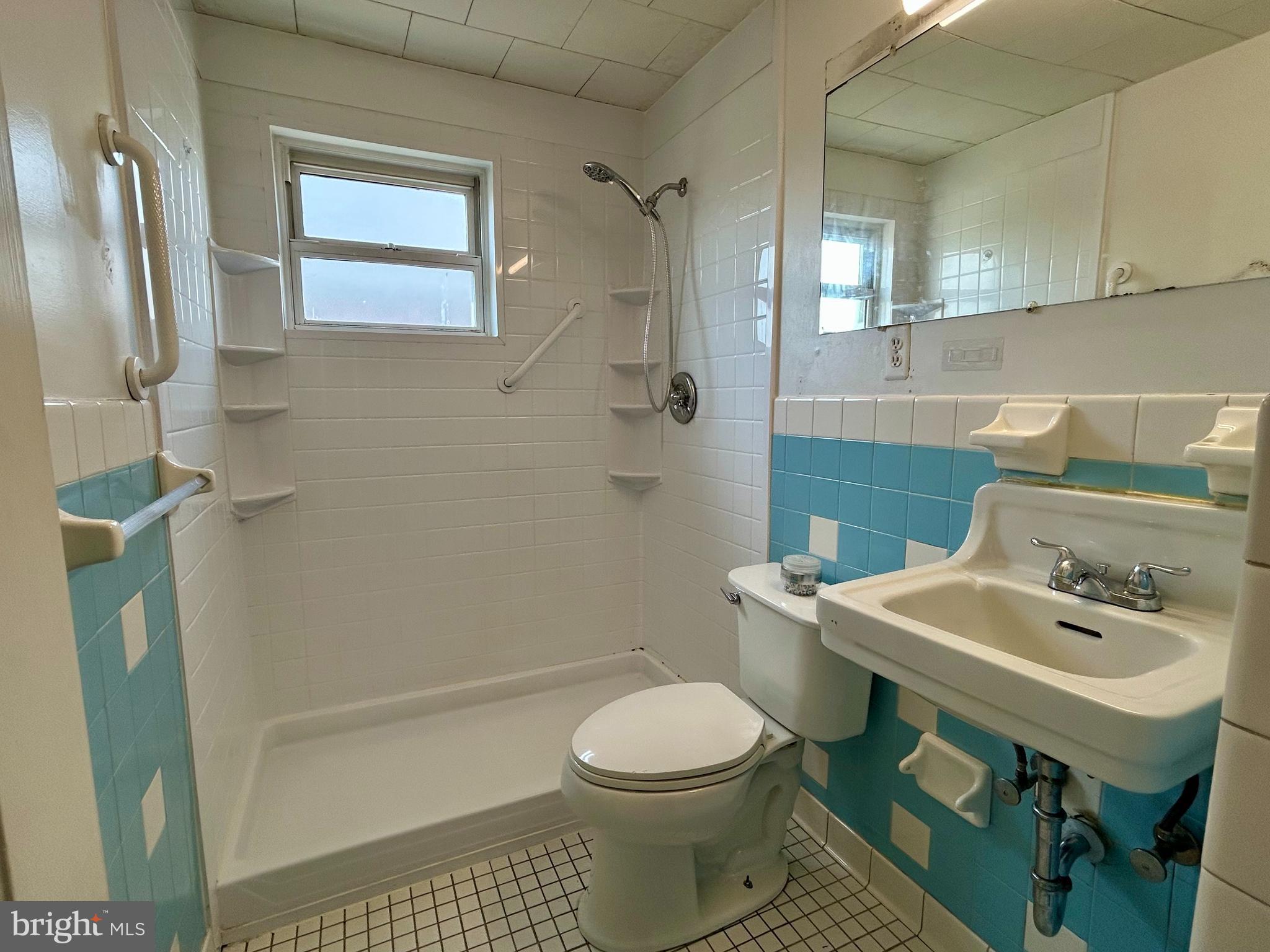 7242 Conley Street Baltimore, MD 21224 - Photo 9 of 18 a bathroom with a sink toilet and shower