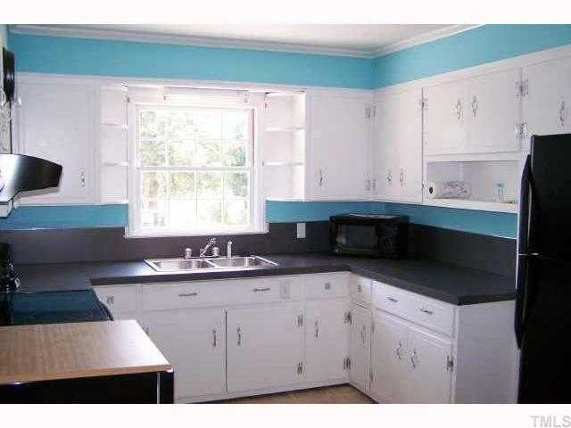 507 Lake Road Creedmoor, NC 27522 - Photo 5 of 7 Large kitchen has new stove, portable dishwasher, refrigerator and microwave. Laundry/mud room is adjacent to the kitchen with new washer and dryer, closet and new pedestrian door.