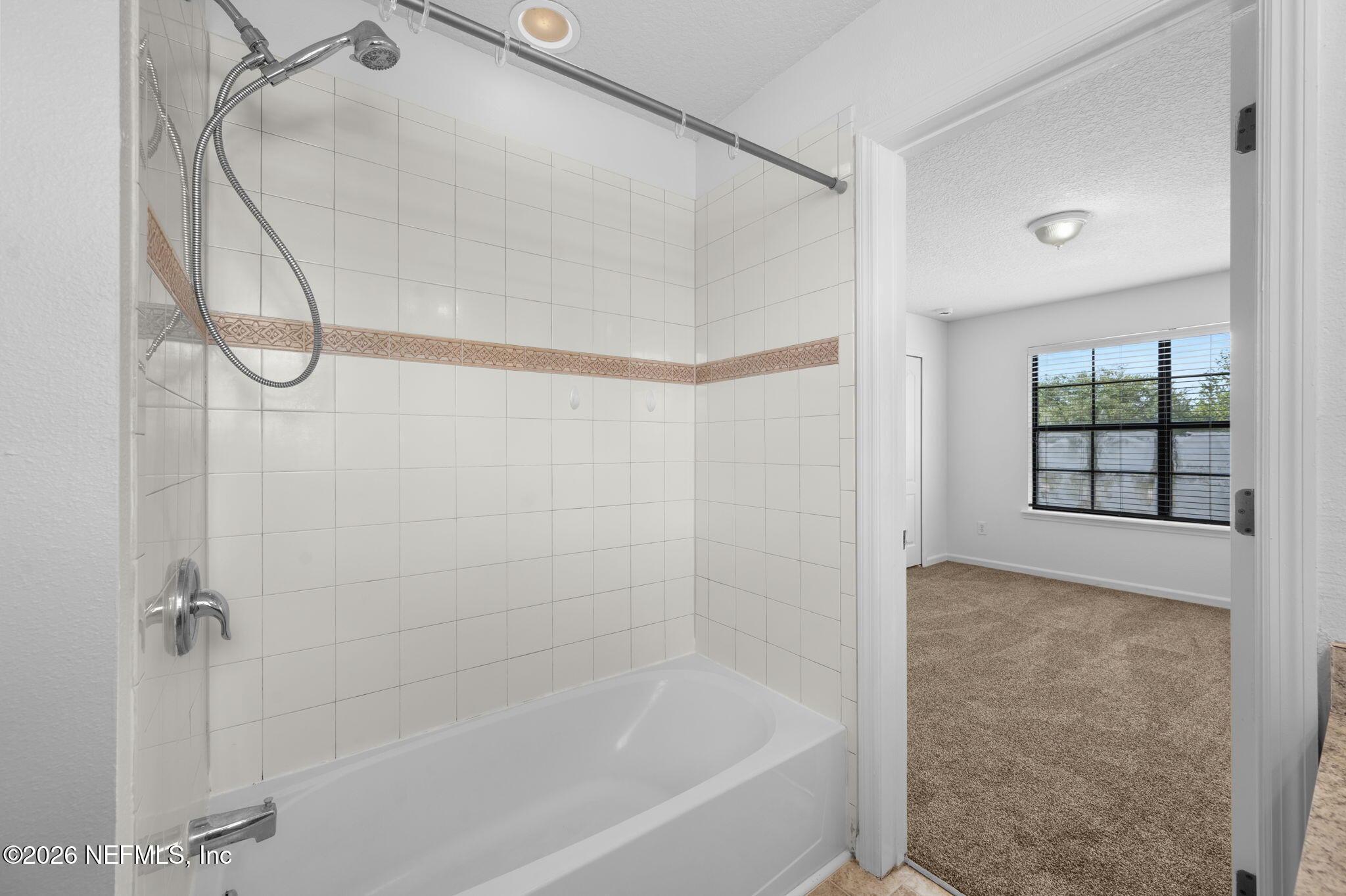 253 Syrah Way St. Augustine, FL 32084 - Photo 24 of 39 a bathroom with a bathtub