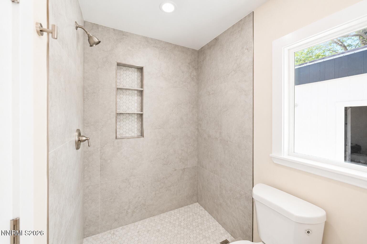 742 Ruth Street Carson City, NV 89701 - Photo 9 of 25 a bathroom with a toilet and a shower