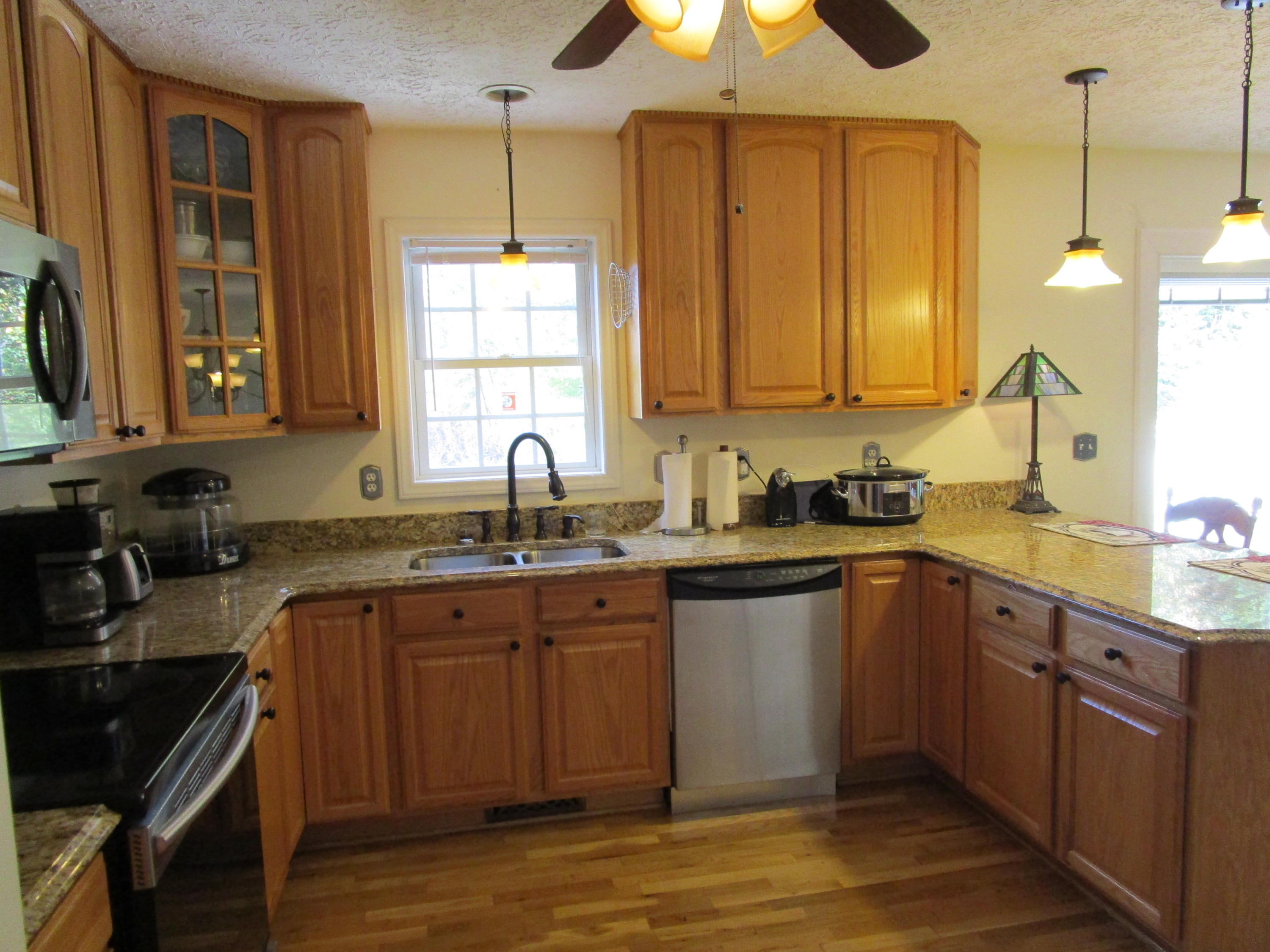 520 Green Level Road Boones Mill, VA 24065 - Photo 13 of 43 a kitchen with a sink cabinets and window