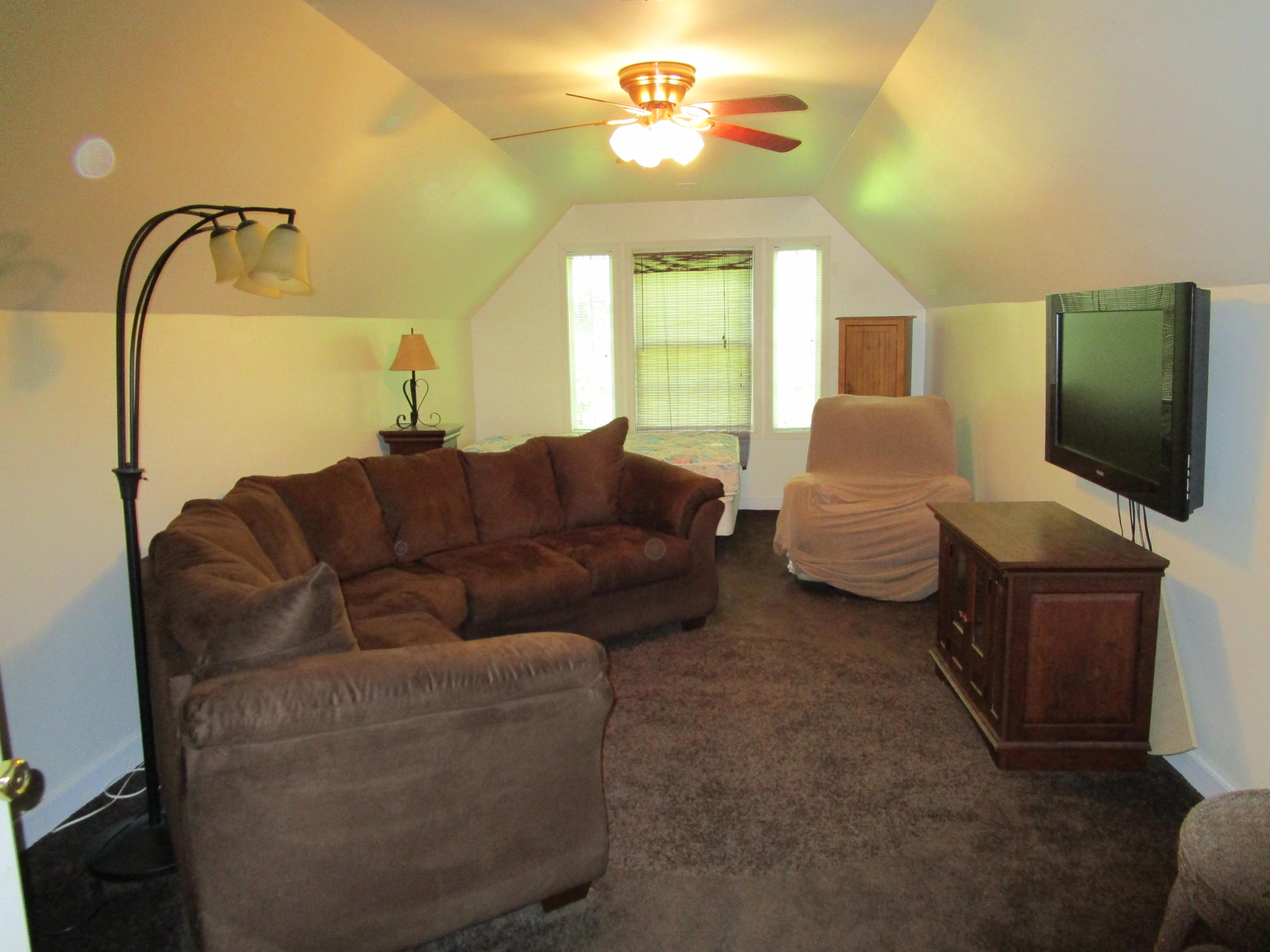 520 Green Level Road Boones Mill, VA 24065 - Photo 19 of 43 a living room with furniture and a flat screen tv