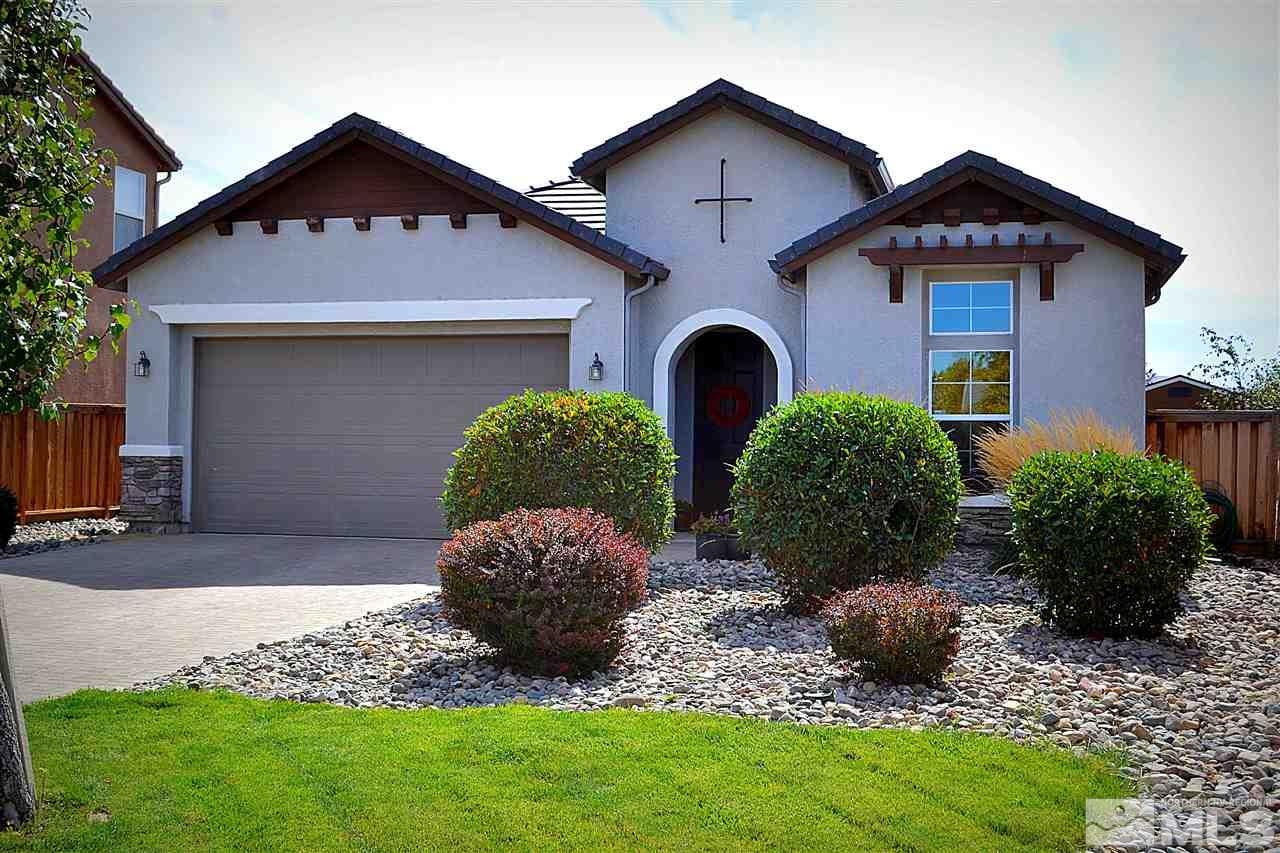 310 Teramo Drive Reno, NV 89521 - Photo 1 of 1 a front view of house with yard and green space