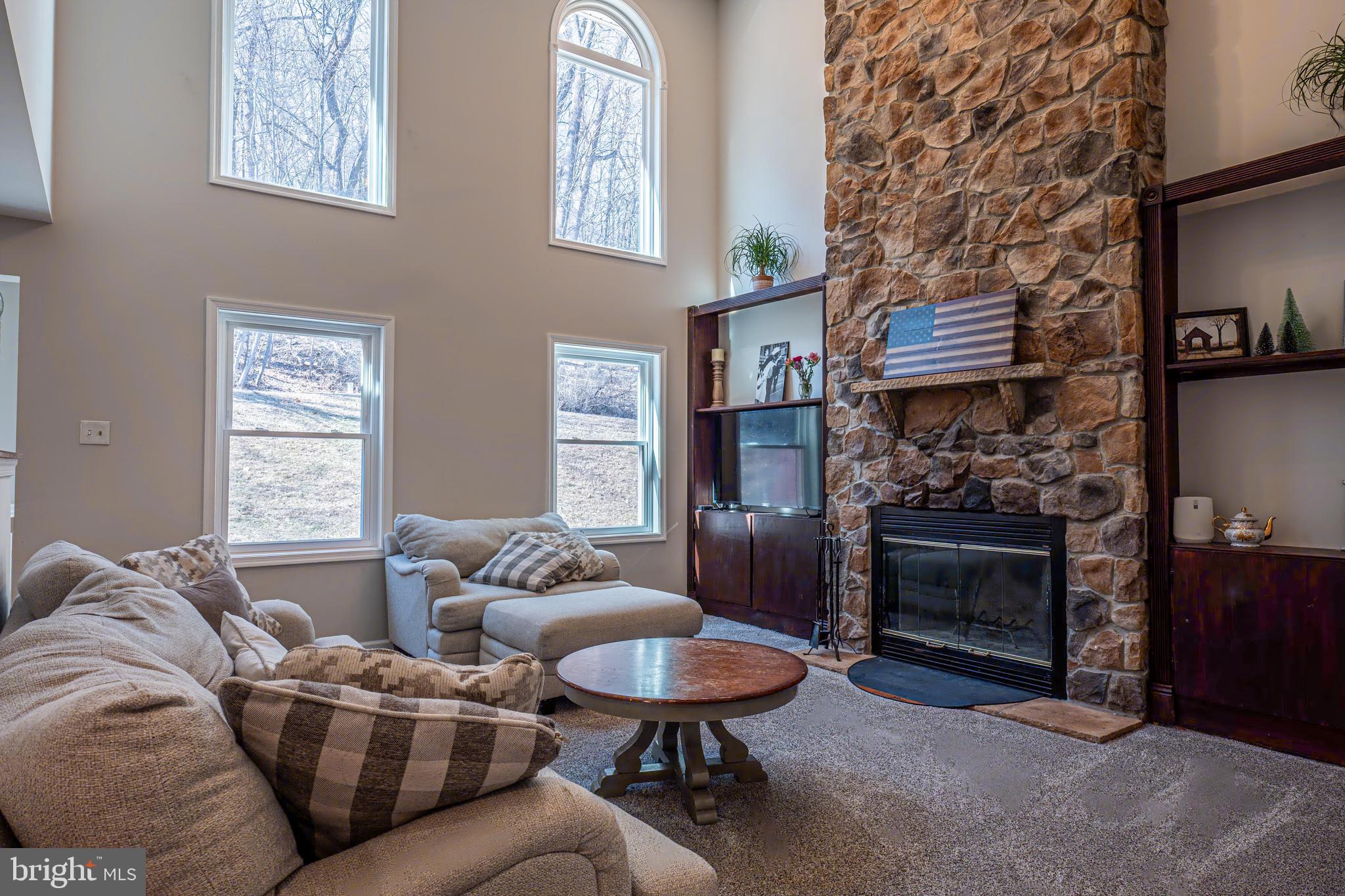9833 Fox Road Frederick, MD 21702 - Photo 11 of 48 a living room with furniture and a fireplace