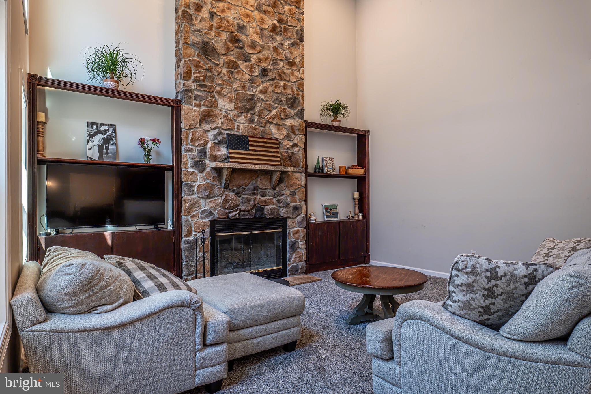 9833 Fox Road Frederick, MD 21702 - Photo 12 of 48 a living room with furniture and a flat screen tv