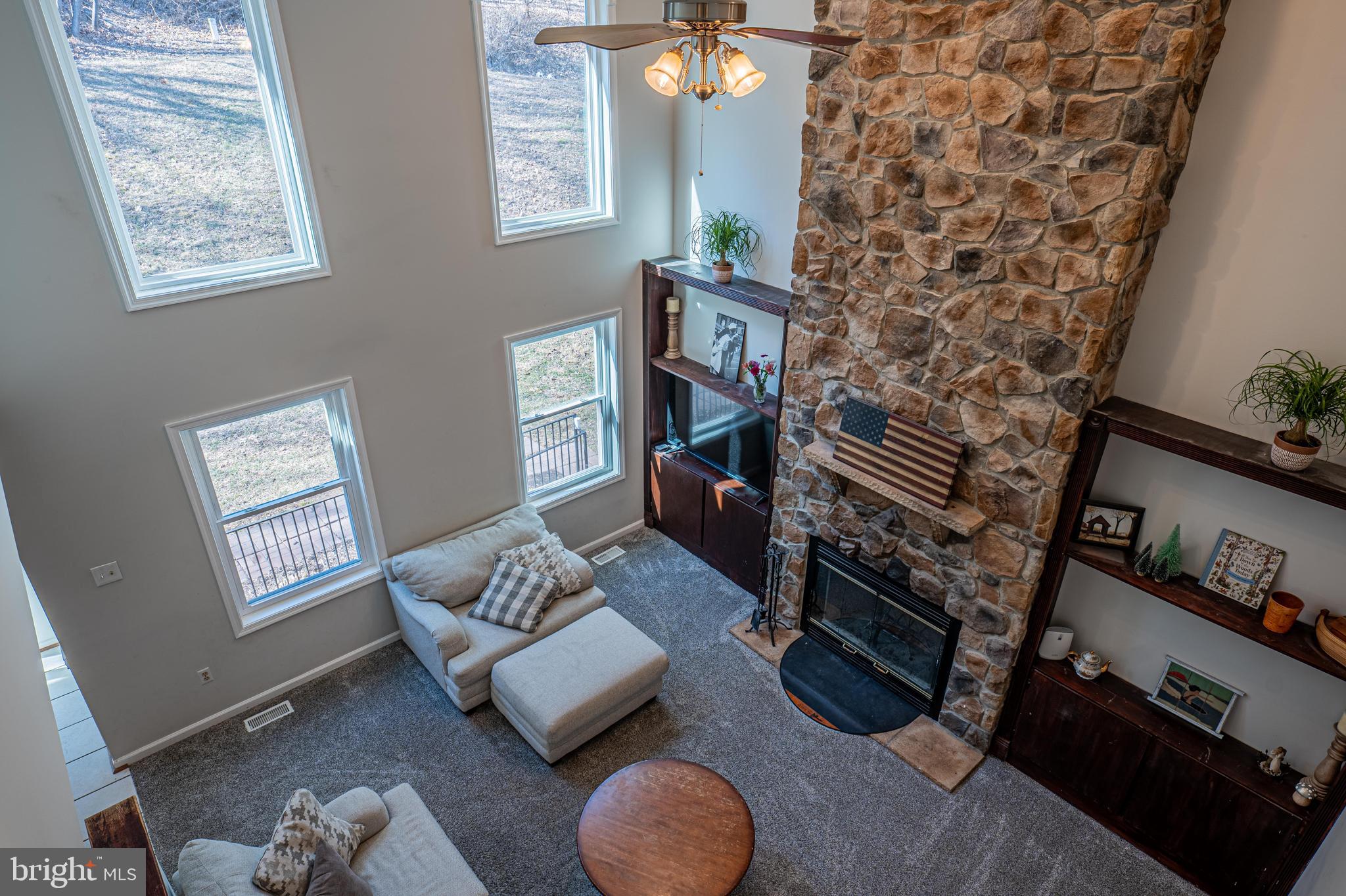 9833 Fox Road Frederick, MD 21702 - Photo 13 of 48 a living room with furniture and a fireplace