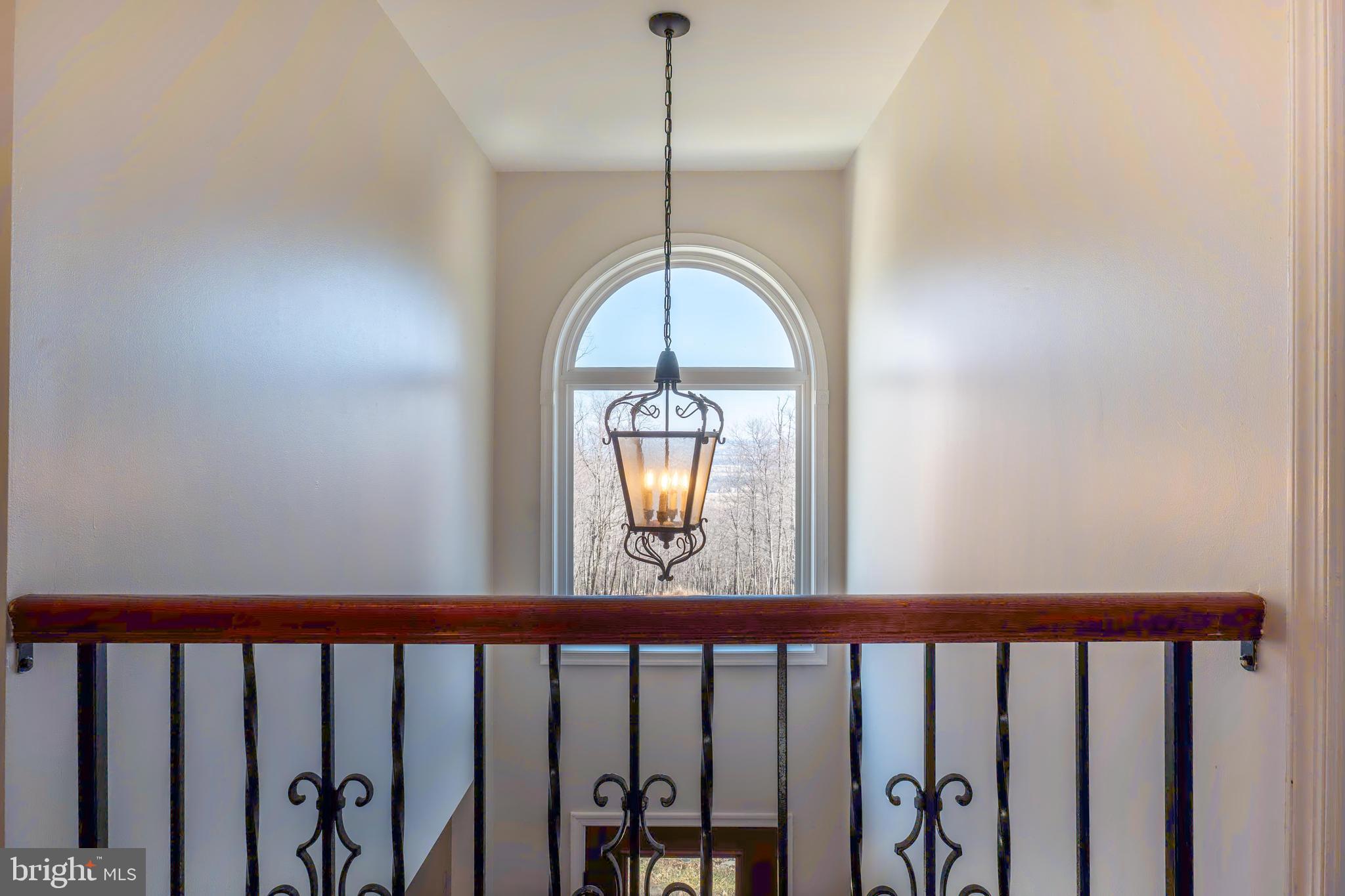 9833 Fox Road Frederick, MD 21702 - Photo 14 of 48 a view of a hallway with wooden floor