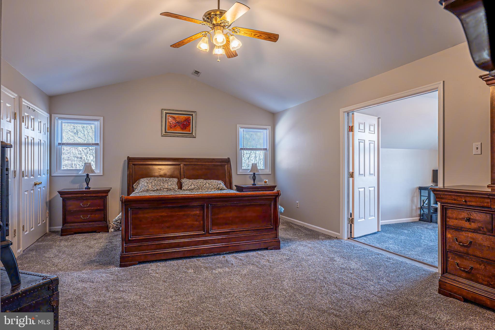 9833 Fox Road Frederick, MD 21702 - Photo 15 of 48 a room with a bed and a chandelier