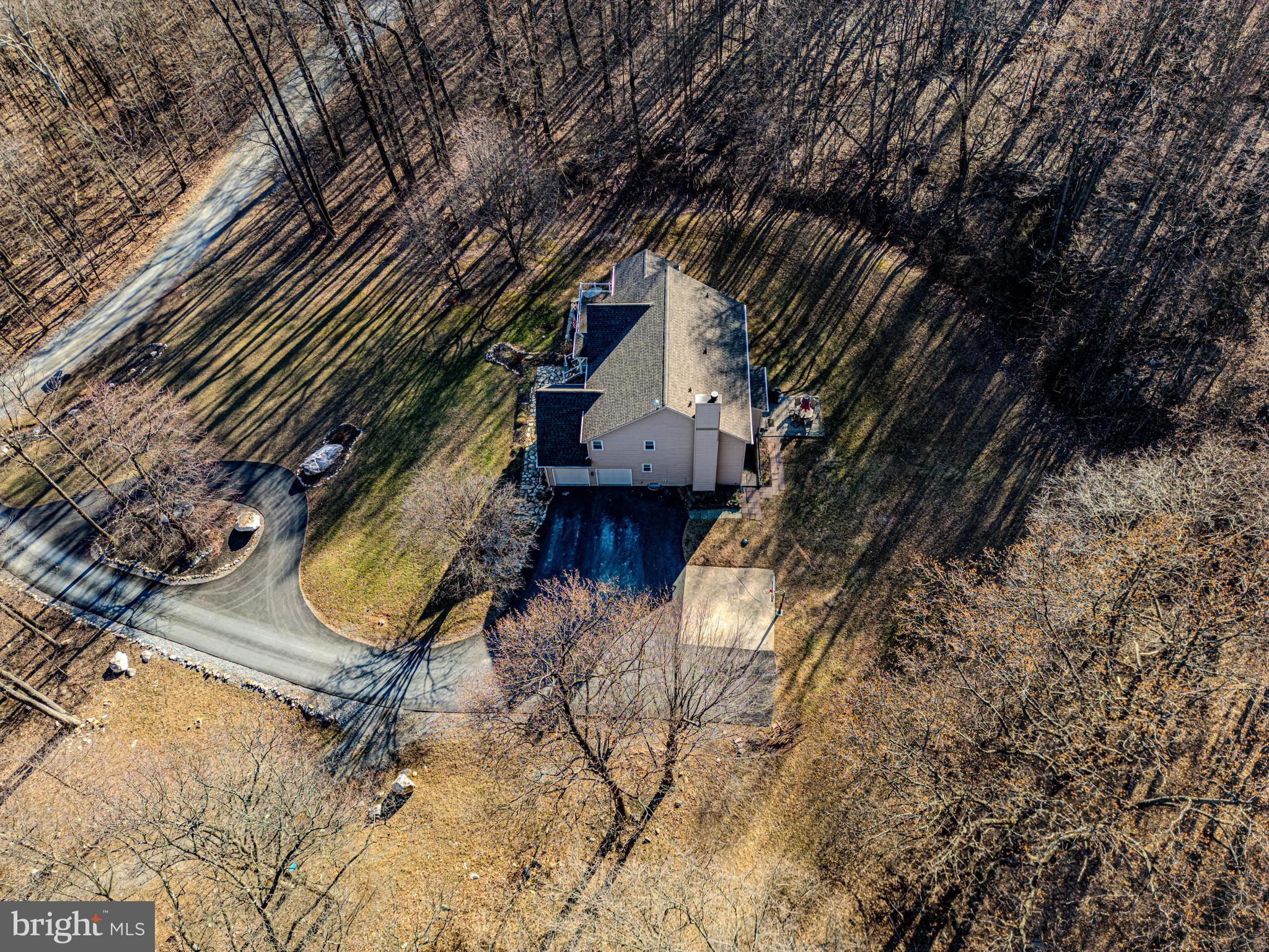 9833 Fox Road Frederick, MD 21702 - Photo 17 of 48 a view of a backyard with a tree