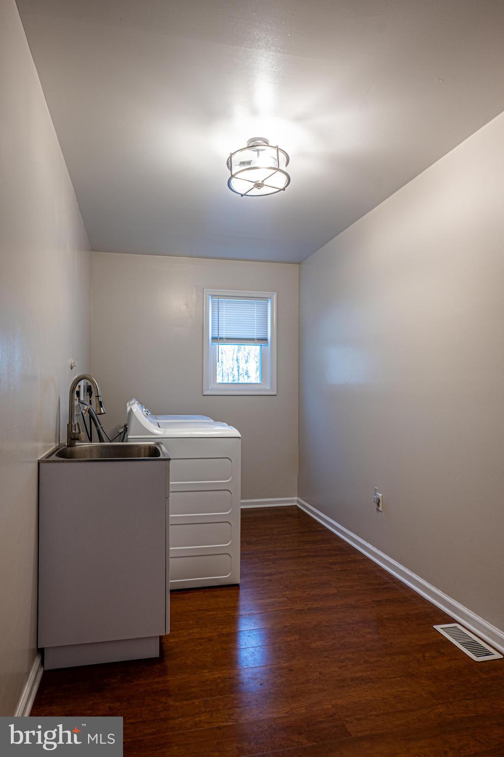 9833 Fox Road Frederick, MD 21702 - Photo 21 of 48 a view of an empty room with a window and wooden floor
