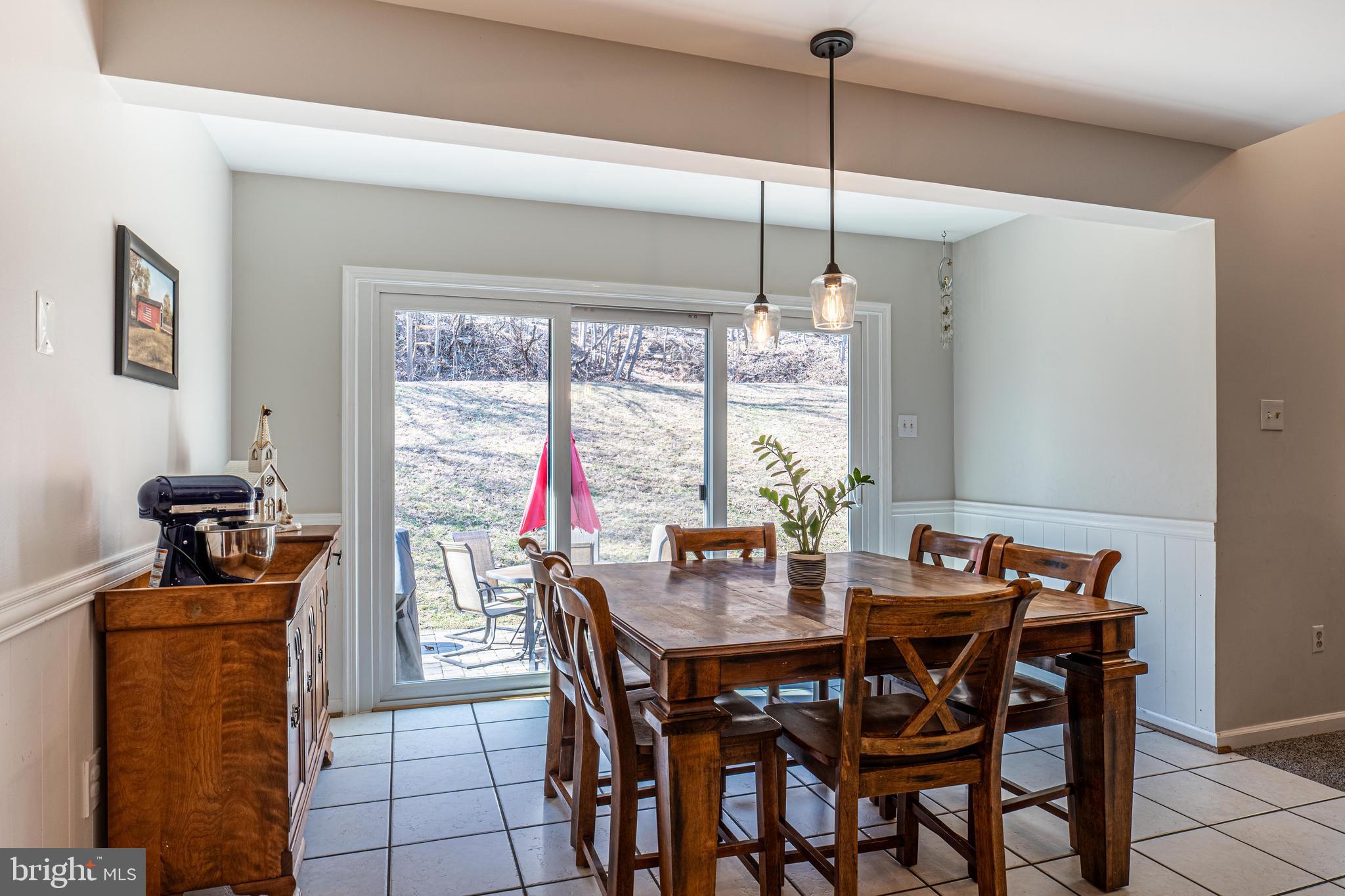 9833 Fox Road Frederick, MD 21702 - Photo 25 of 48 a view of a dining room with furniture window and outside view