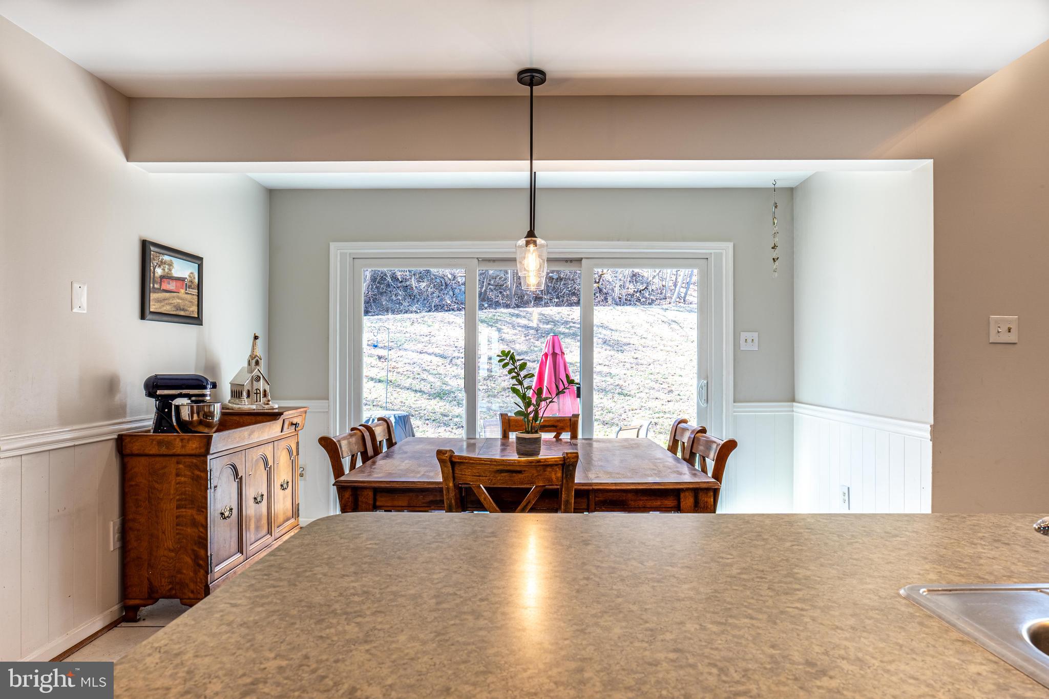 9833 Fox Road Frederick, MD 21702 - Photo 34 of 48 a living room with furniture and a chandelier