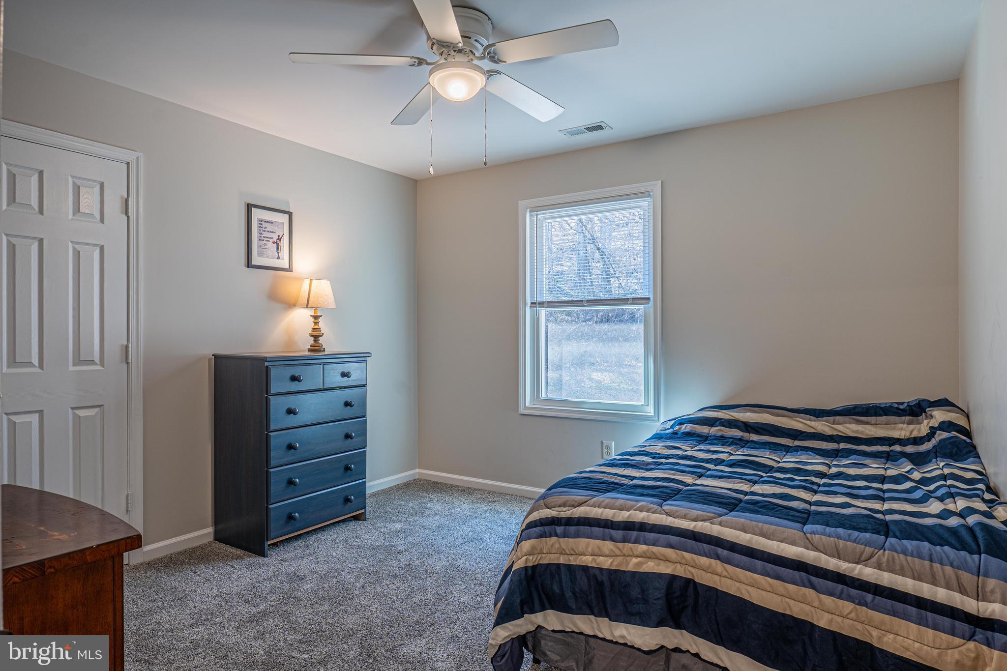 9833 Fox Road Frederick, MD 21702 - Photo 35 of 48 a bedroom with a bed and a window
