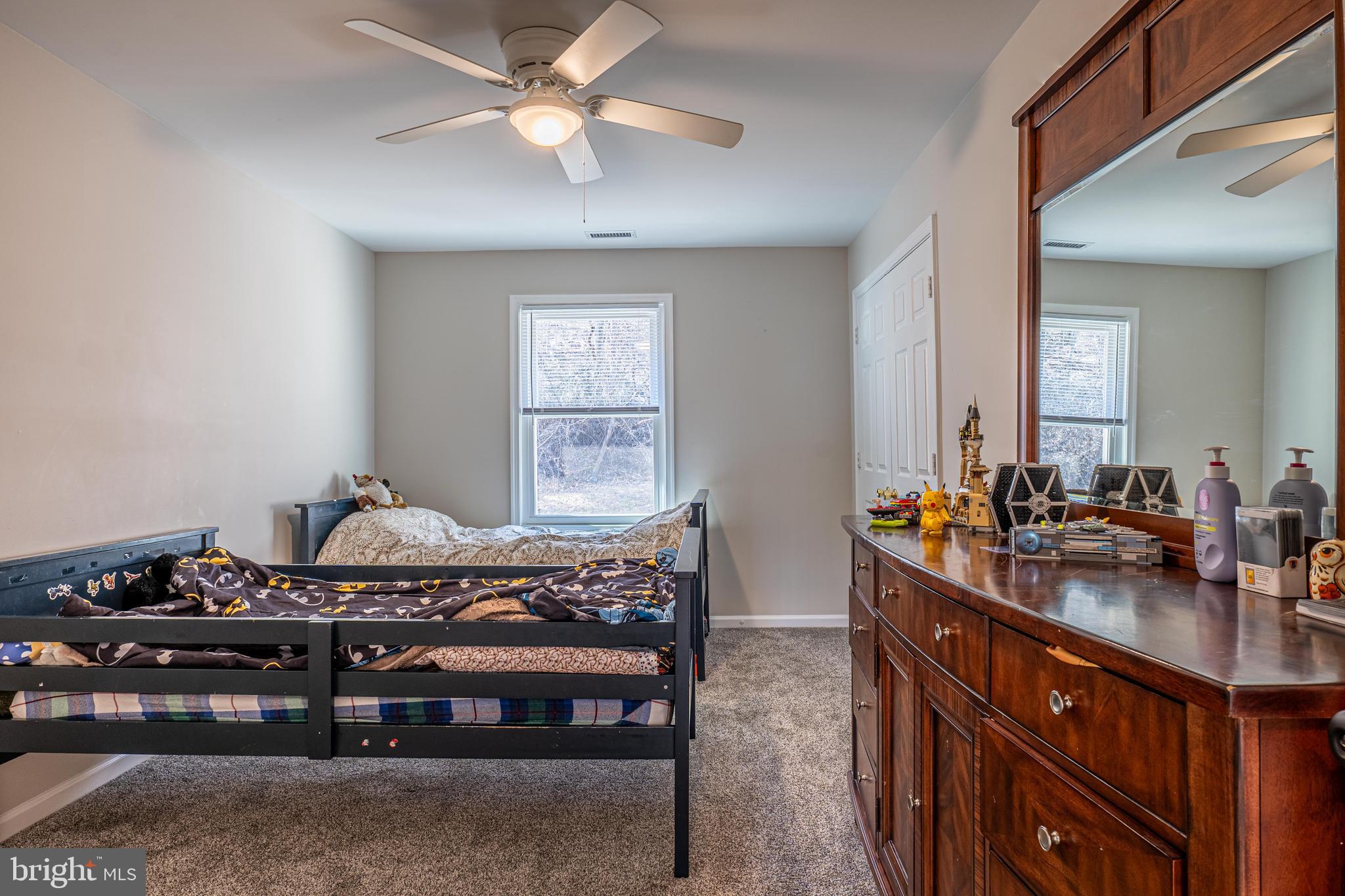 9833 Fox Road Frederick, MD 21702 - Photo 39 of 48 a room with furniture a chandelier and a window