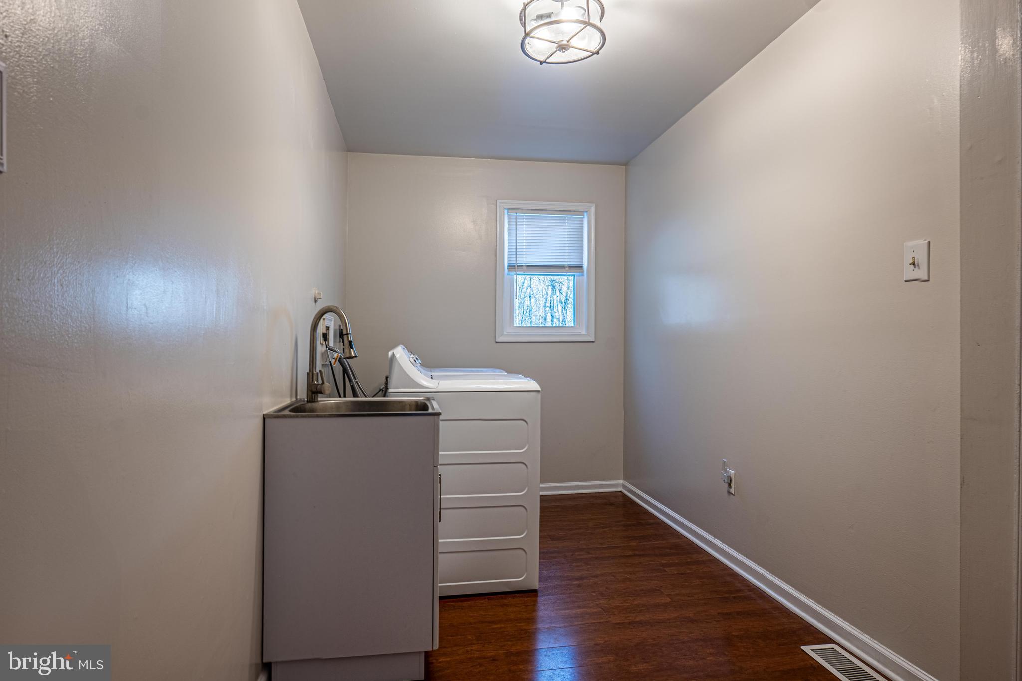 9833 Fox Road Frederick, MD 21702 - Photo 47 of 48 a view of a room with wooden floor and sink
