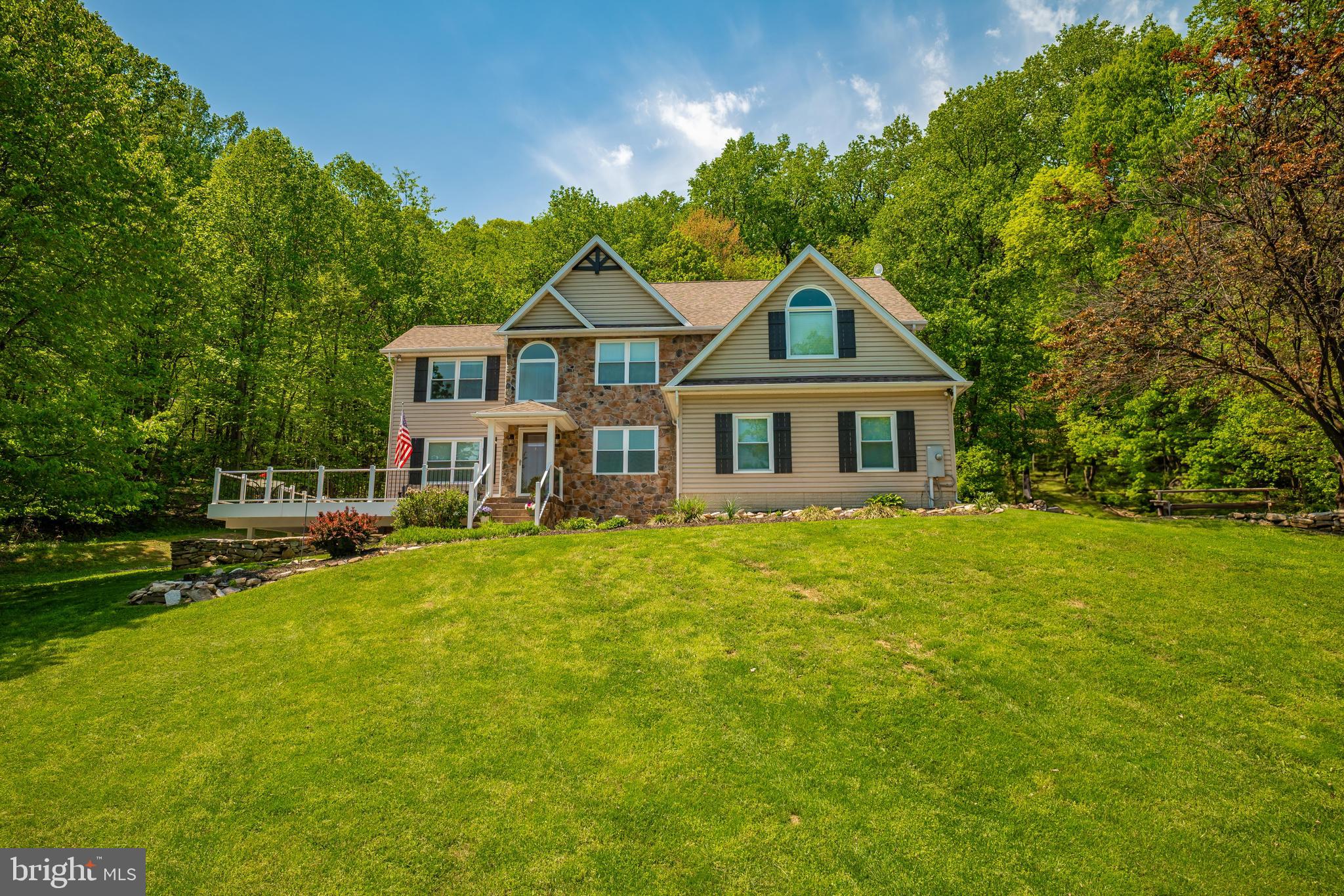 9833 Fox Road Frederick, MD 21702 - Photo 5 of 48 a front view of a house with a garden