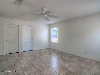 3248 West Treece Place Tucson, AZ 85742 - Photo 9 of 17 a view of an empty room with a window
