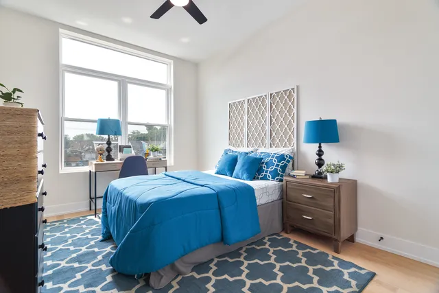 a bedroom with a bed and a window