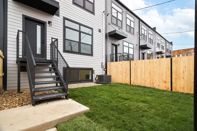 a view of a house with a small yard