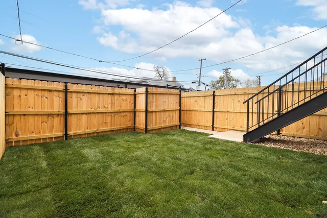 a view of a brick house with a outdoor space