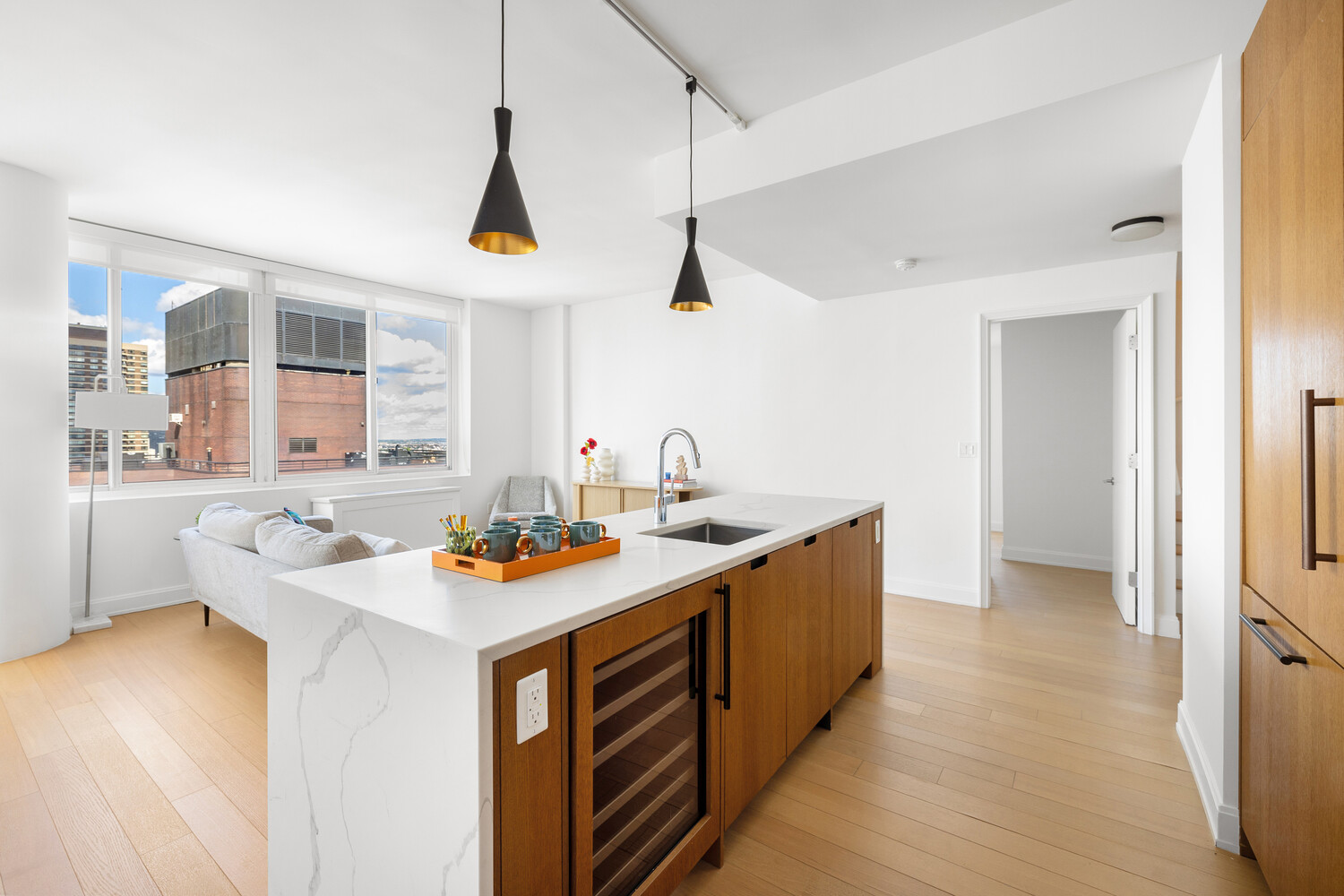 420 East 54th Street, Unit PH6 Manhattan, NY 10022 - Photo 5 of 10 a kitchen that has a sink and a stove in it