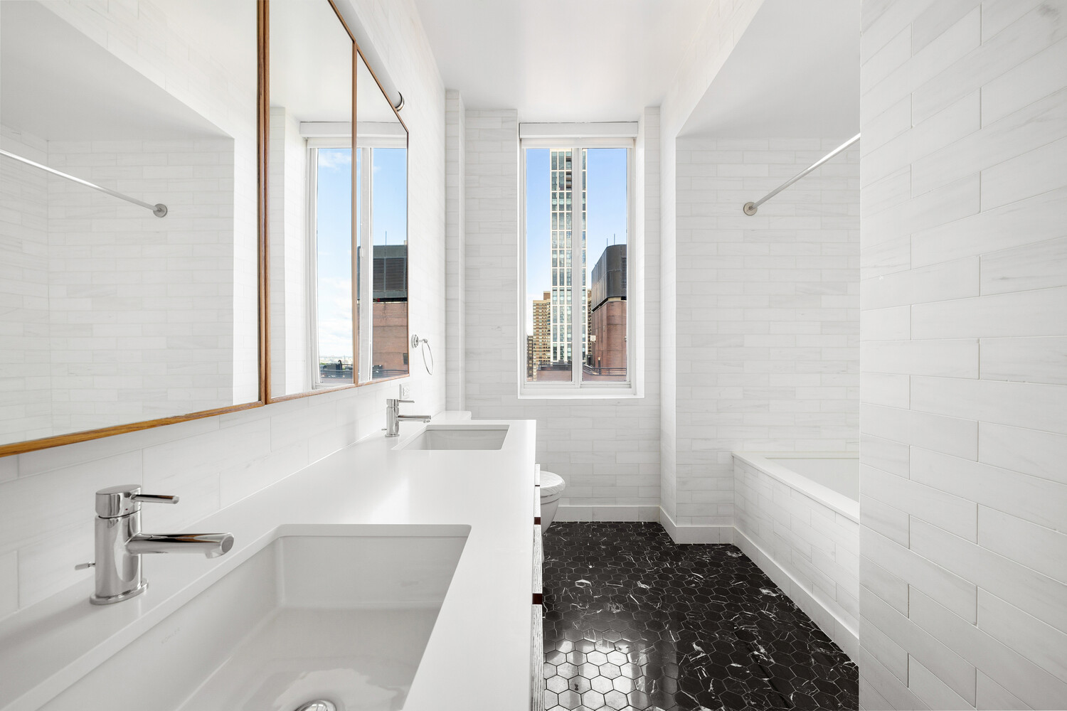 420 East 54th Street, Unit PH6 Manhattan, NY 10022 - Photo 7 of 10 a bathroom with a bathtub and a sink