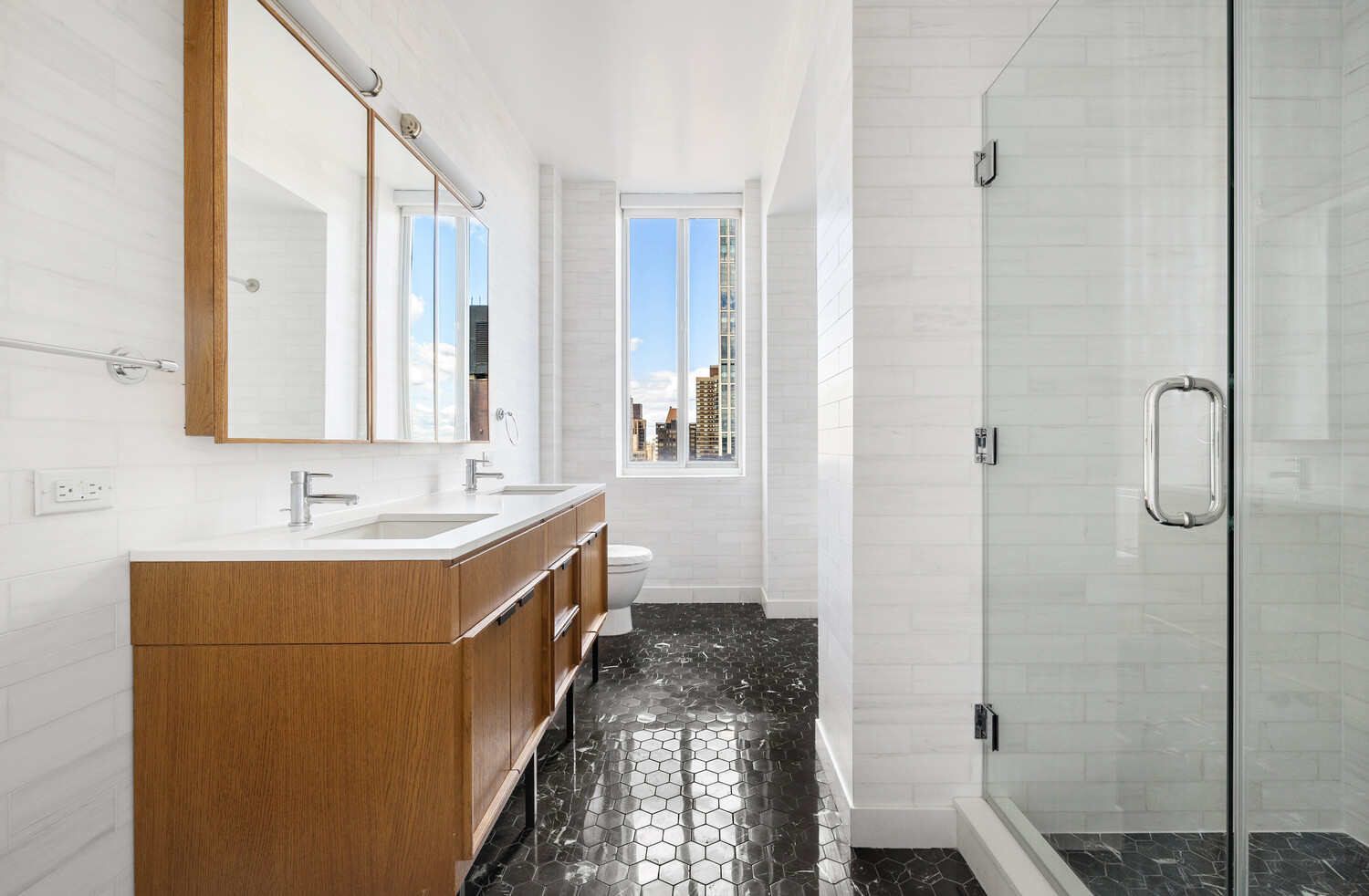 420 East 54th Street, Unit PH6 Manhattan, NY 10022 - Photo 9 of 10 a bathroom with a tub sink and mirror