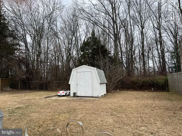 a house view with a backyard space