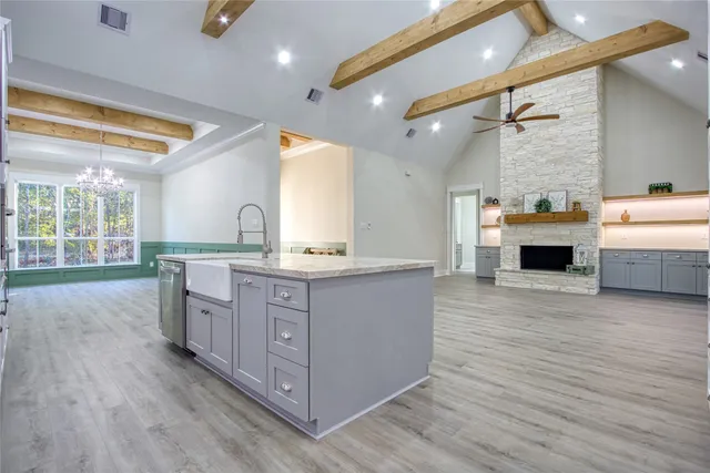 a view of kitchen and hall with wooden floor