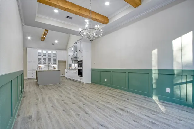 a large spacious bathroom with a large mirror and a sink