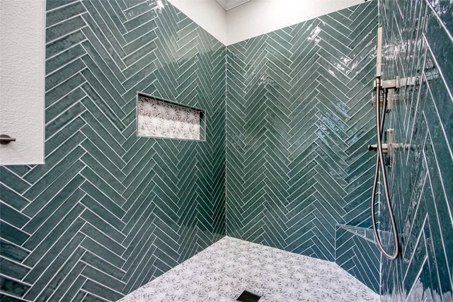 a spacious bathroom with a granite countertop sink mirror and bathtub