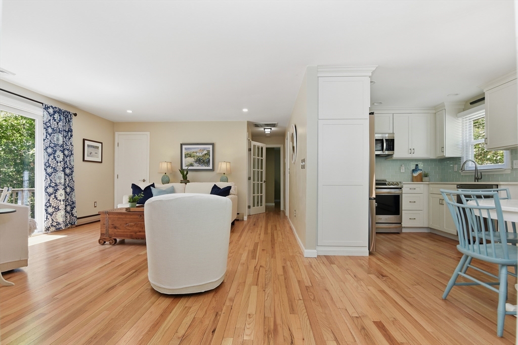 8 Emerald Way Sandwich, MA 02644 - Photo 16 of 36 a living room with furniture and a wooden floor
