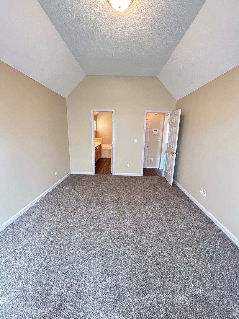 4806 Ashcroft Drive Memphis, TN 38125 - Photo 13 of 18 a view of an empty room with a window