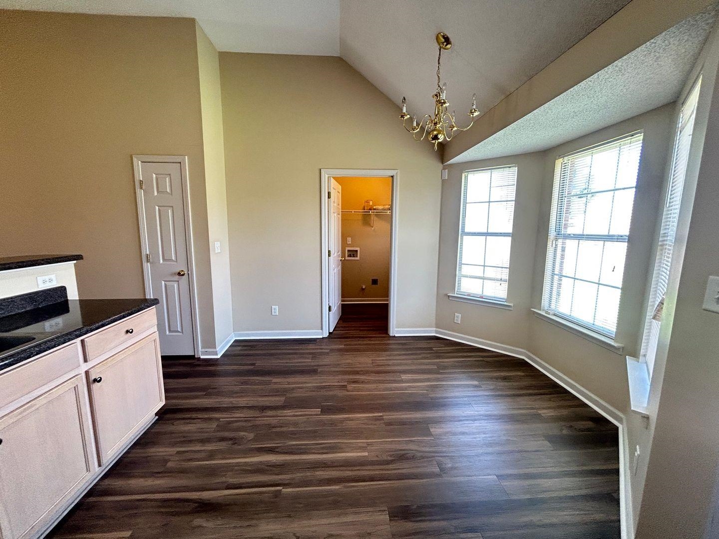 4806 Ashcroft Drive Memphis, TN 38125 - Photo 9 of 18 a view of a room with wooden floor and windows