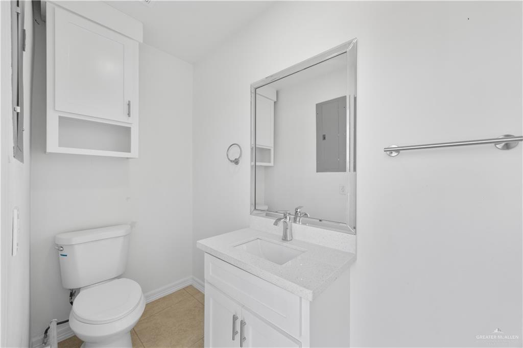 2902 Alejandra Street Mission, TX 78574 - Photo 14 of 17 a bathroom with a sink toilet and mirror