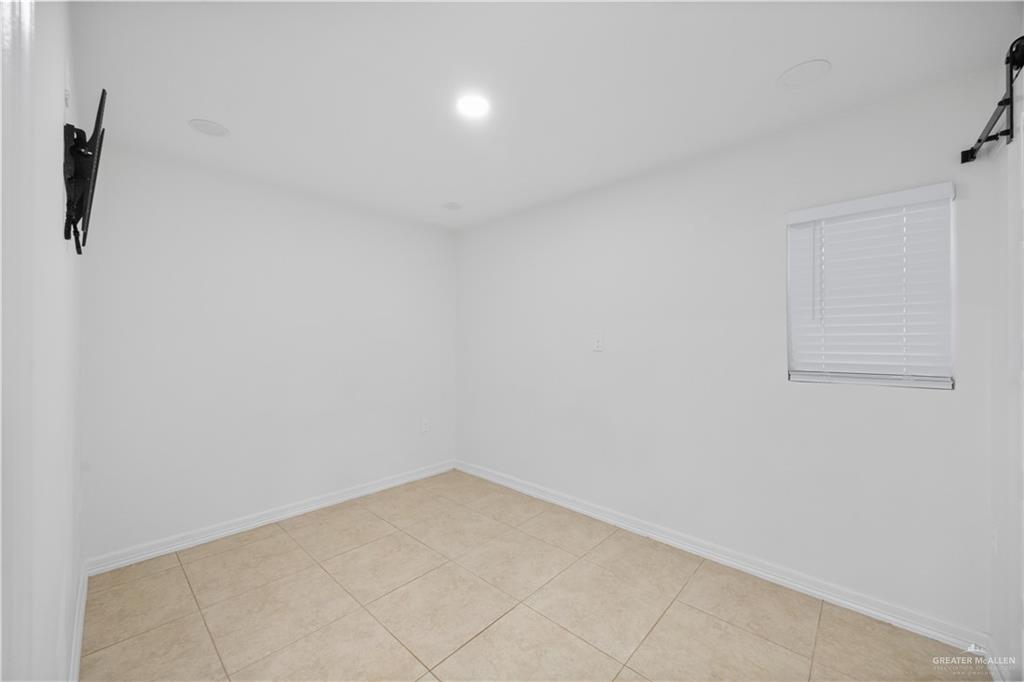 2902 Alejandra Street Mission, TX 78574 - Photo 10 of 17 a view of storage and utility room with empty racks