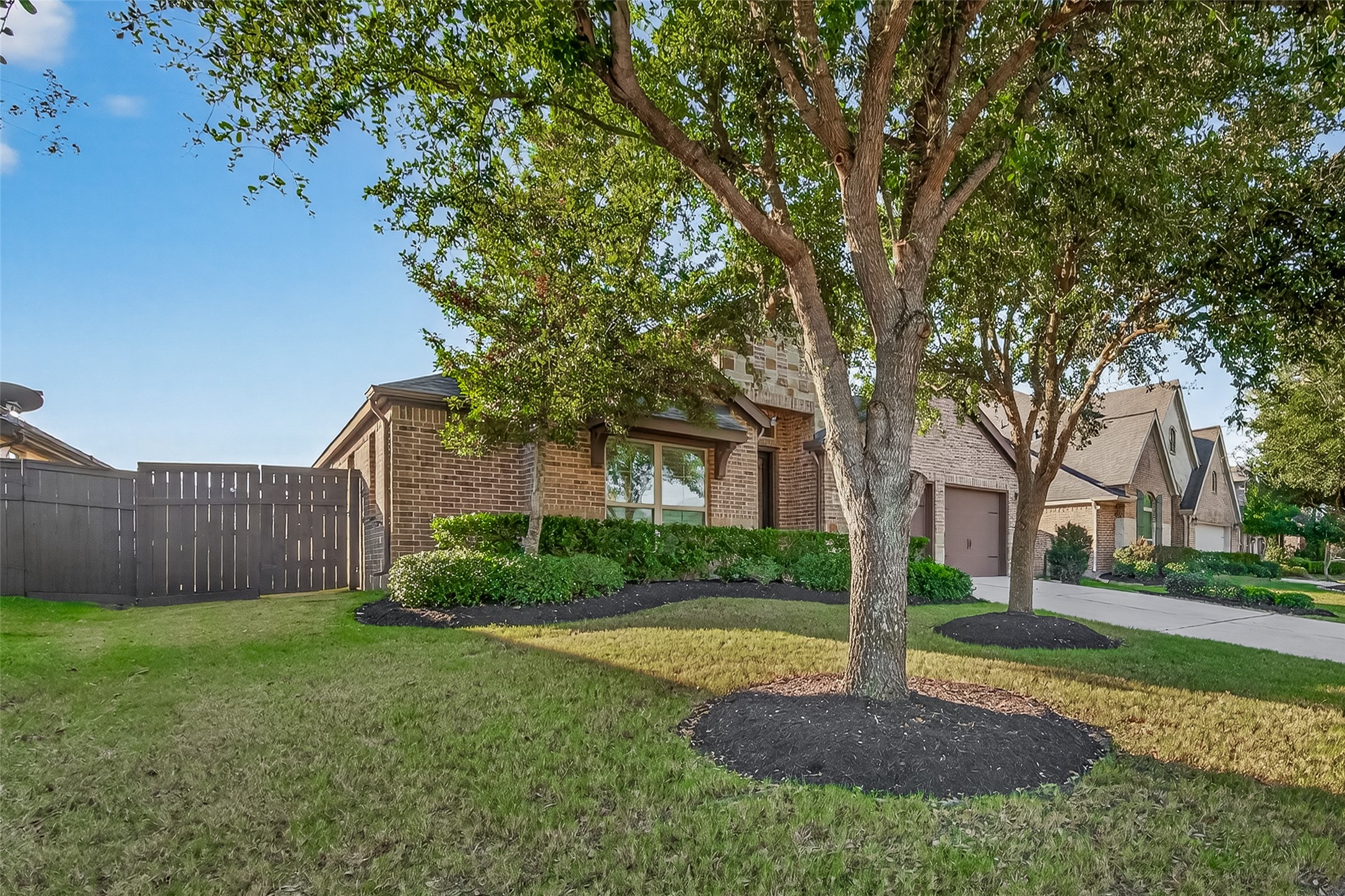 28435 Sycamore Falls Lane Fulshear, TX 77441 - Photo 2 of 46 a view of a garden with large tree